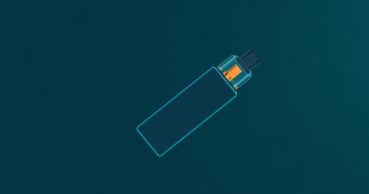 A small USB-shaped vape device on a table